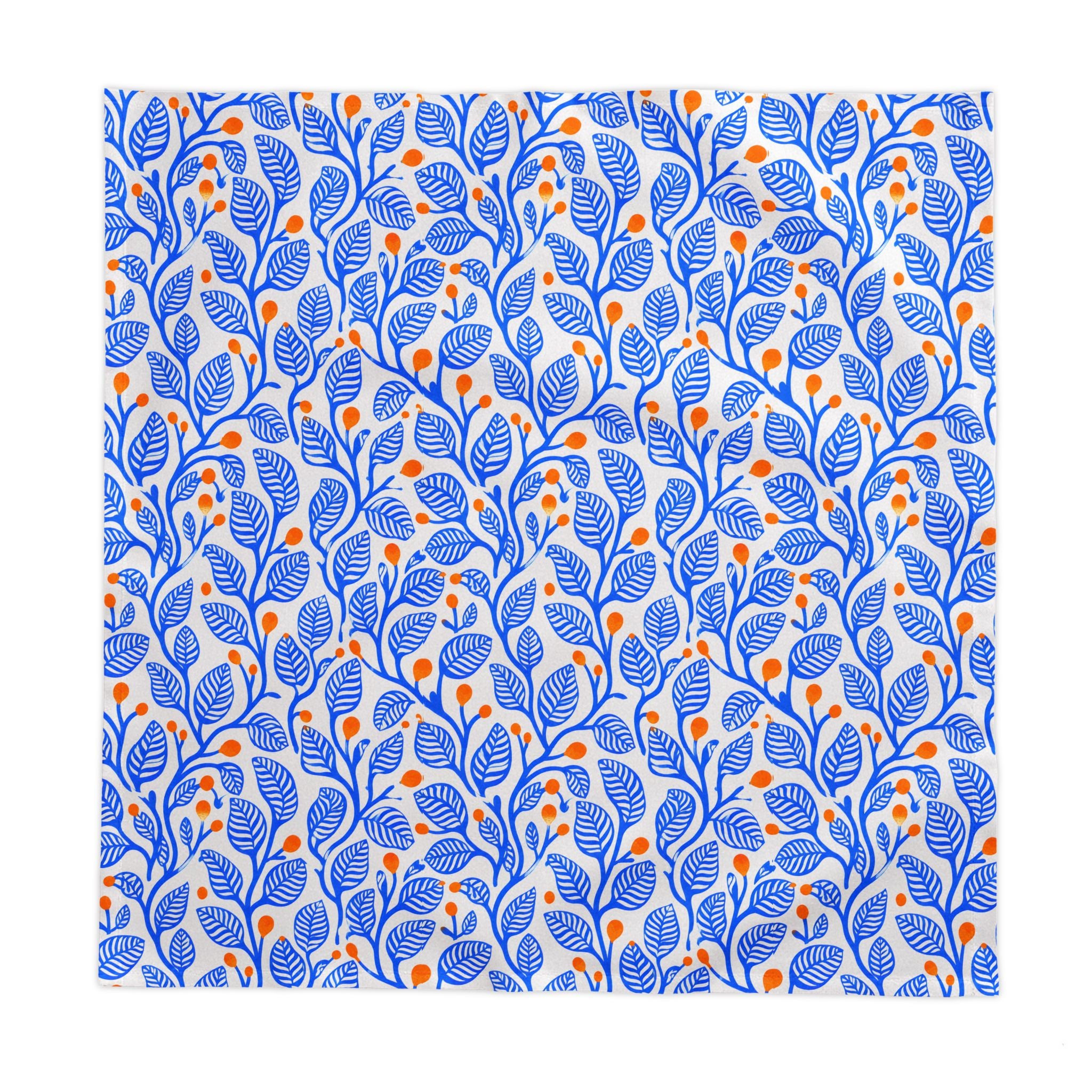 Mediterranean botanical dining table linen with a bold blue leaf pattern and terracotta accents for stylish everyday entertaining.