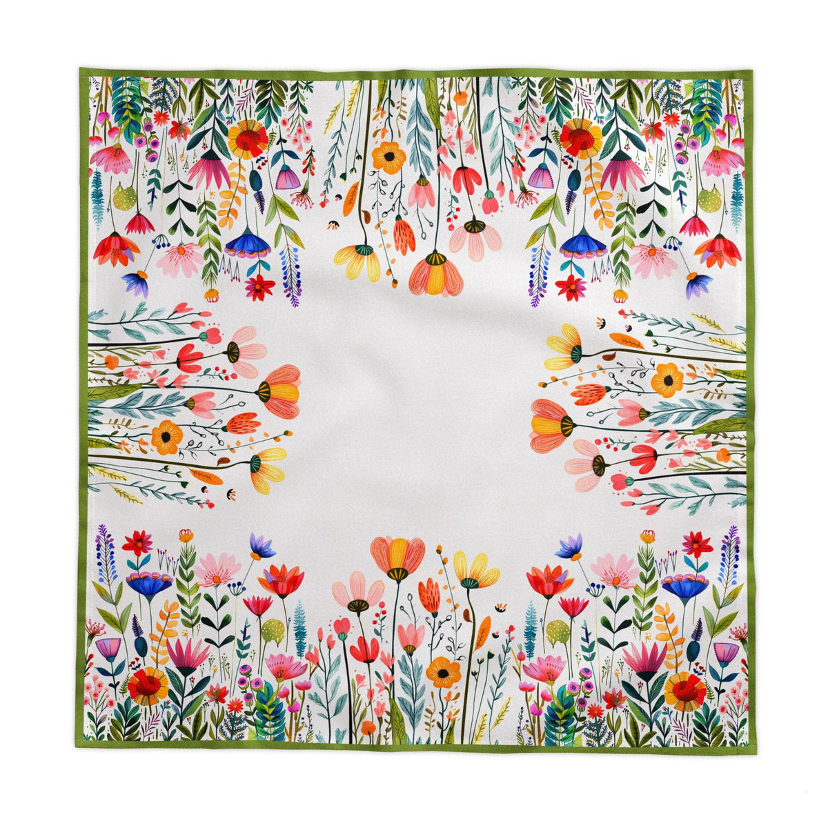 Colourful floral cotton twill tablecloth draped over dining table showing vibrant meadow-inspired pattern