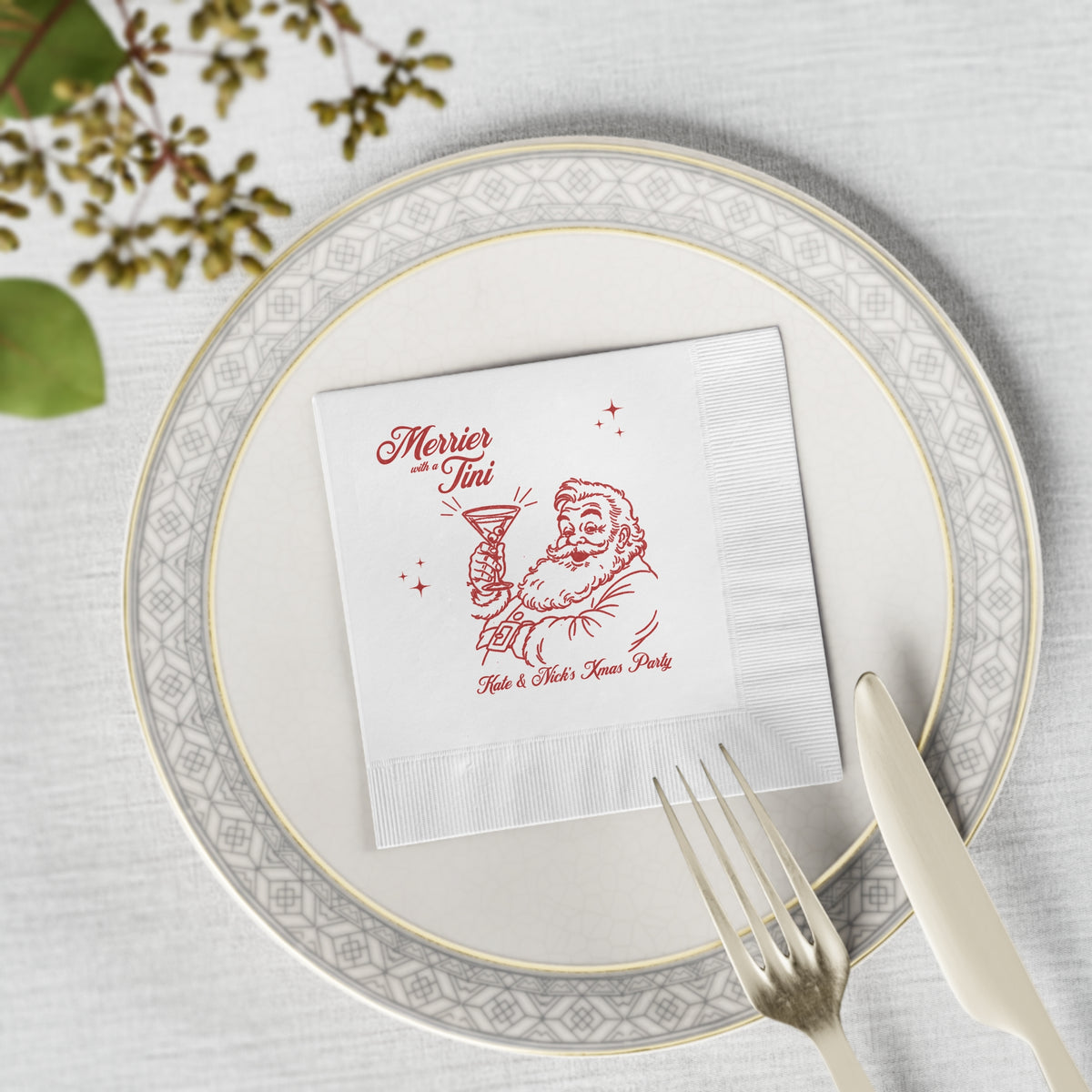 4.8 x 4.8 inch Merrier with a Tini beverage napkin featuring vintage Santa artwork for Christmas cocktails, martinis and mocktails.