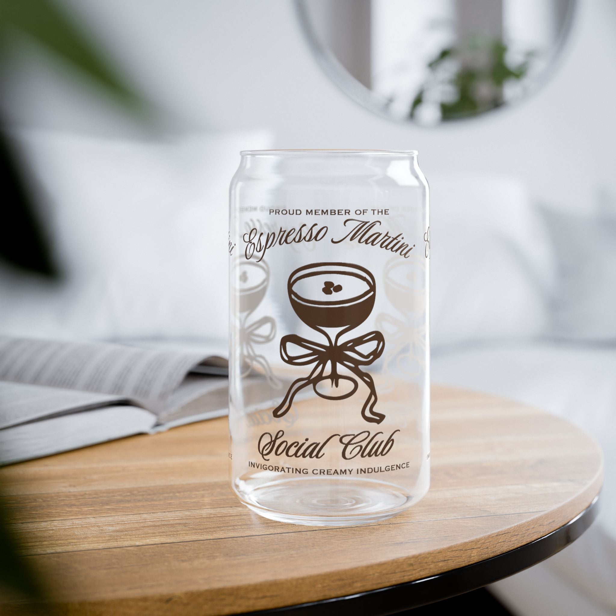 Clear glass sipper cup with bamboo lid and espresso martini illustration.