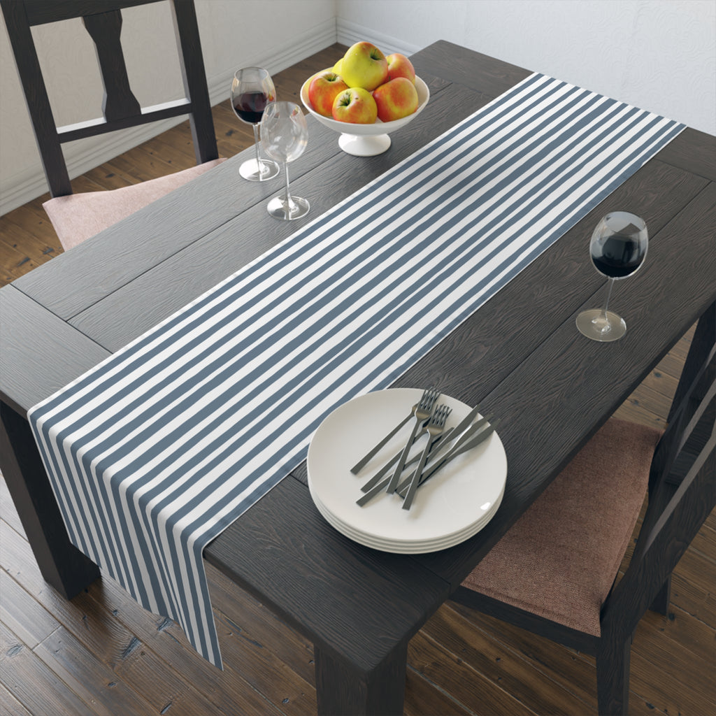 Slate blue striped table runner displayed on a long dining table for modern farmhouse styling