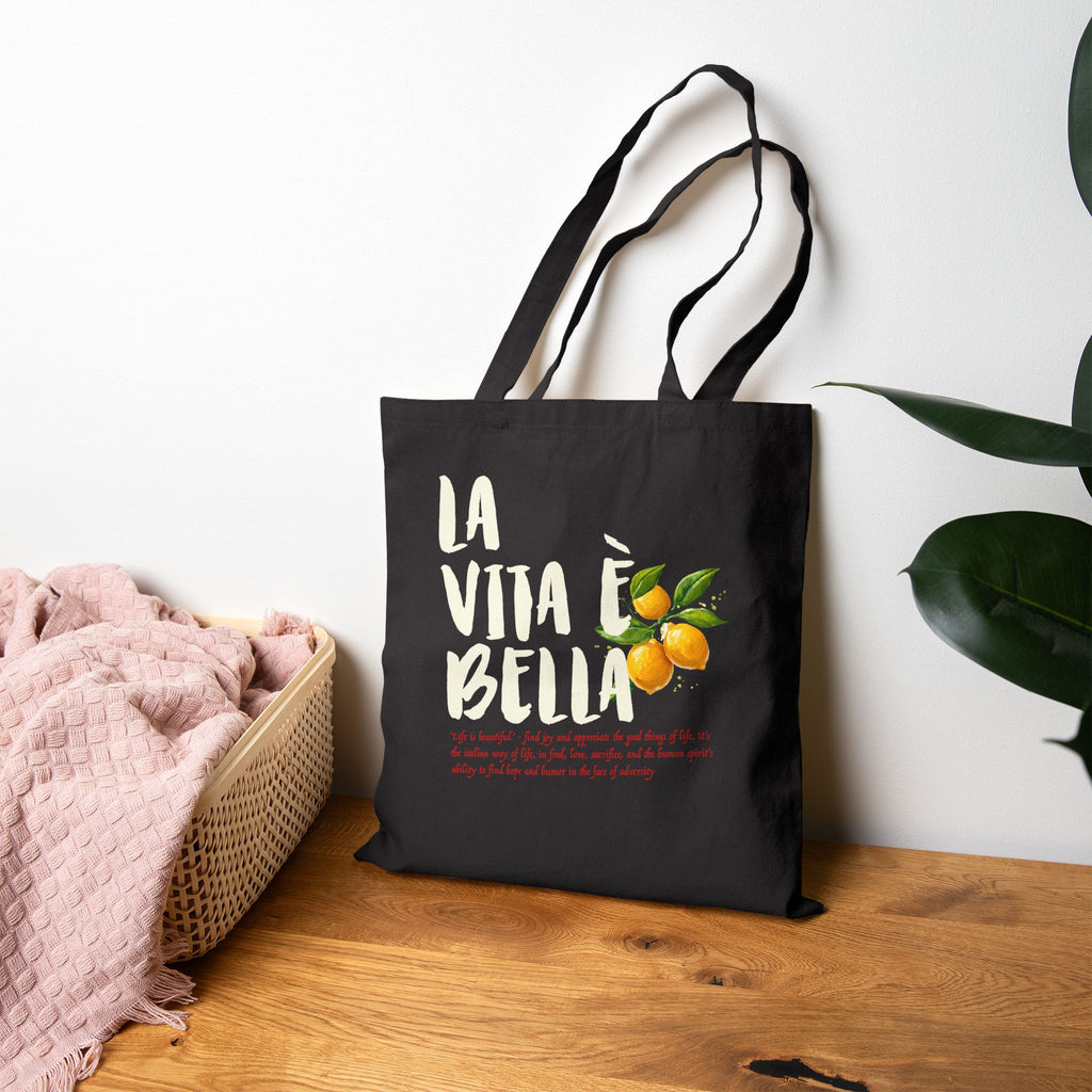 Double-sided cotton canvas tote featuring bright yellow lemons and the Italian phrase La Vita è Bella meaning Life is Beautiful.