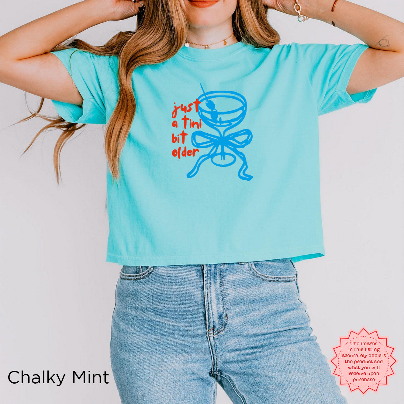 Chalky mint green crop top with playful 'Just A Tini Bit Older' print and martini design for birthday girls.