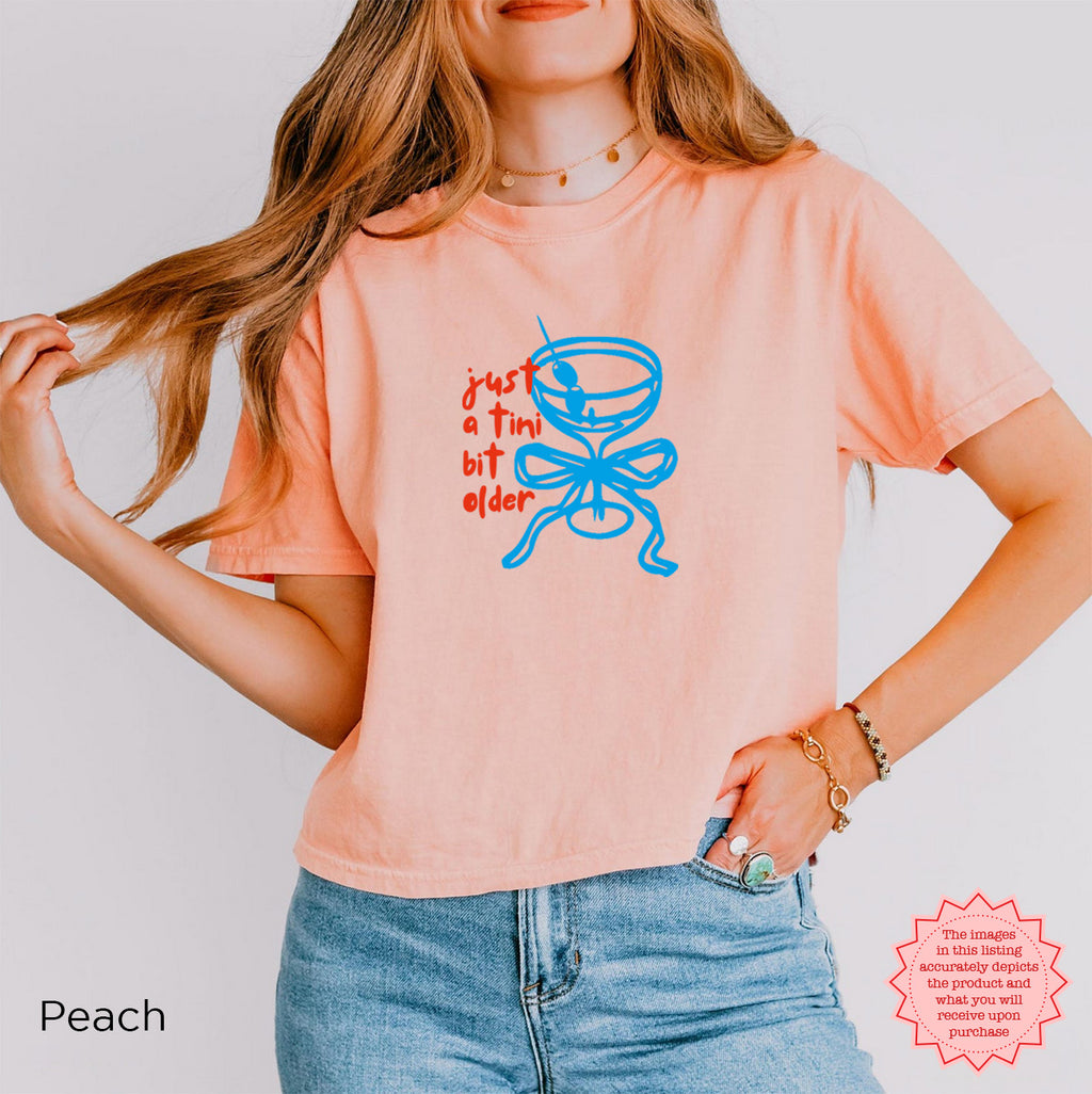 Peach crop top with 'Just A Tini Bit Older' graphic, a fun and quirky gift for any 30th birthday party.