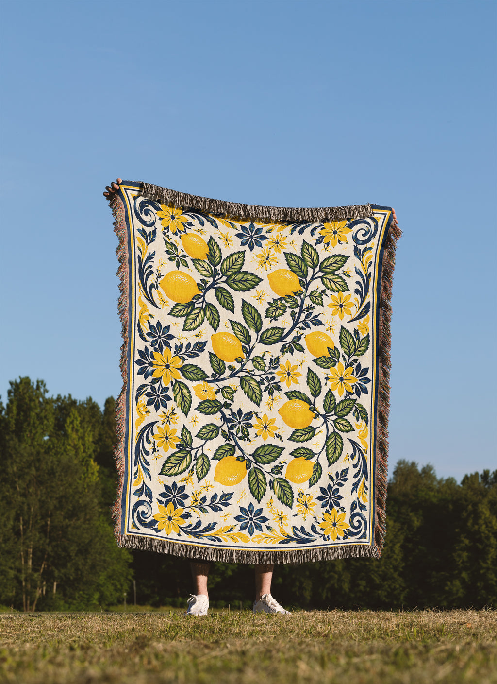 Mediterranean citrus woven blanket with golden lemons, navy accents, and elegant floral border artwork