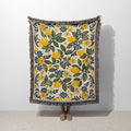 Amalfi Lemons Woven Blanket featuring Mediterranean lemon branches, green leaves, floral details, and colorful fringed edges