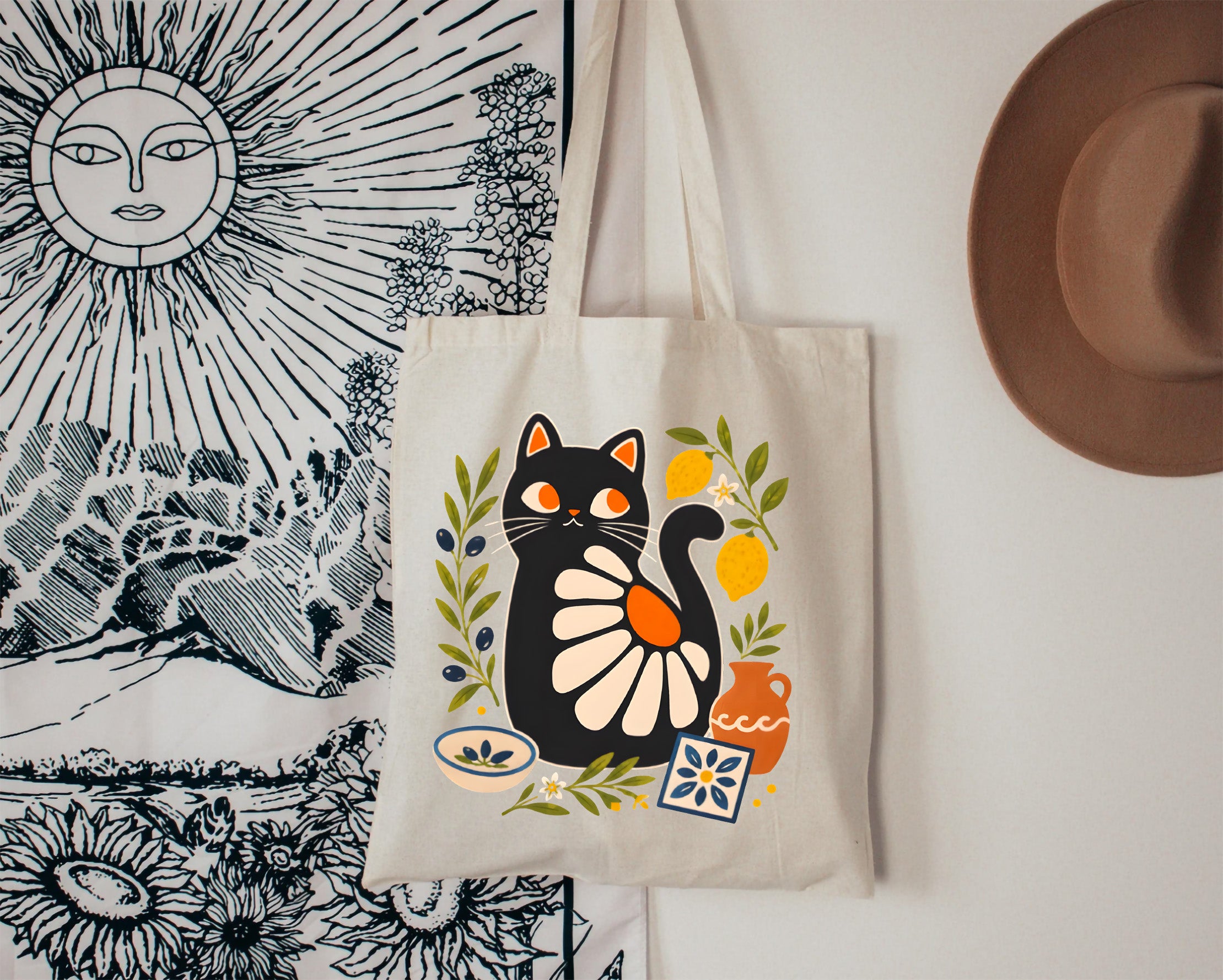 Natural canvas tote bag featuring a modern folk art black cat inspired by Mediterranean coastal living.