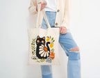 Reusable cotton canvas shopping bag showcasing a Mediterranean Matisse-style black cat illustration.