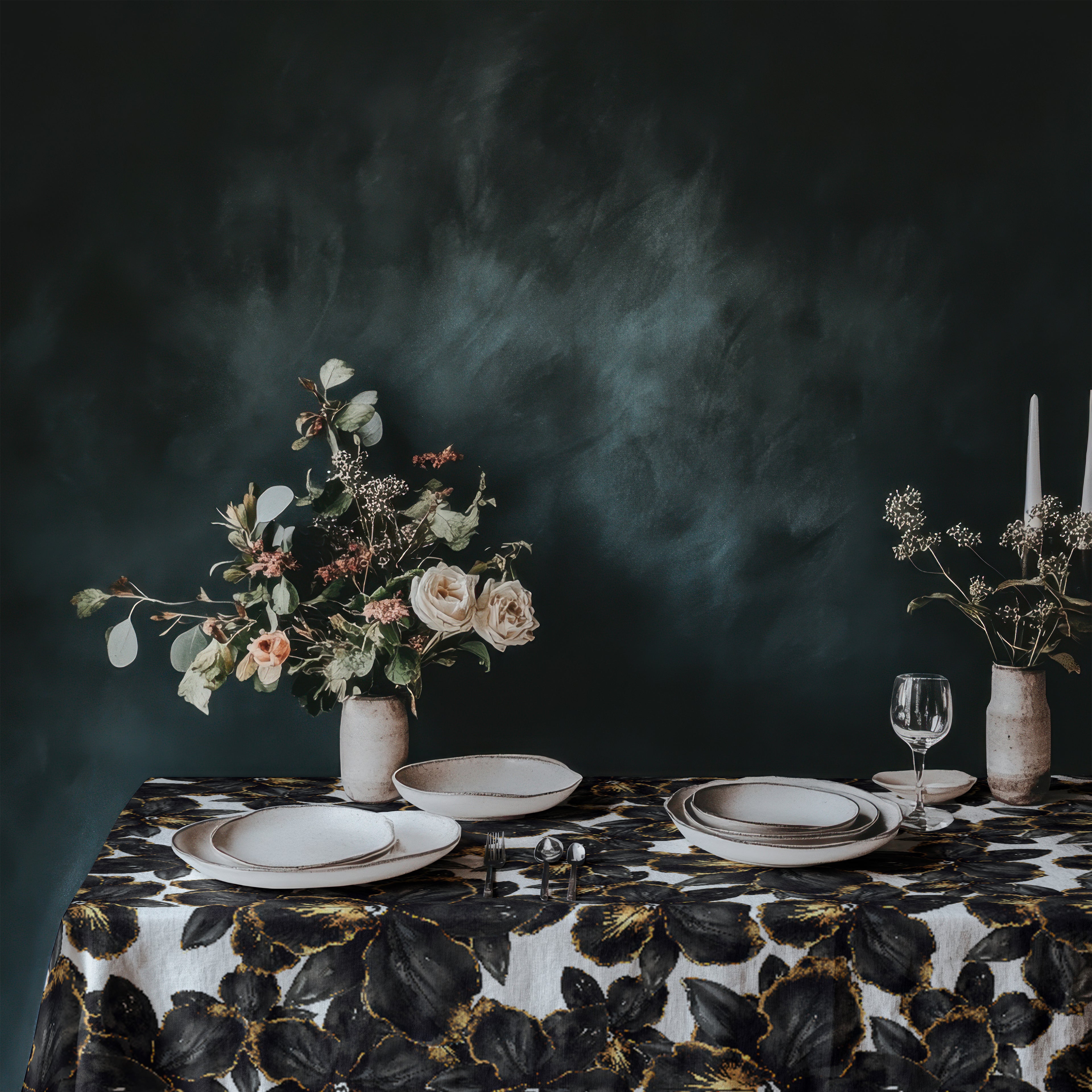 Black orchid tablecloth styled in a moody dining setting with candles and neutral stoneware, contemporary botanical table linen for elegant dinner parties