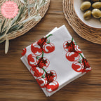 Close-up view of tomato printed cotton napkin showing detailed block print design and soft twill fabric texture