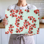 Close-up of tomato block print design on textured tempered glass cutting board