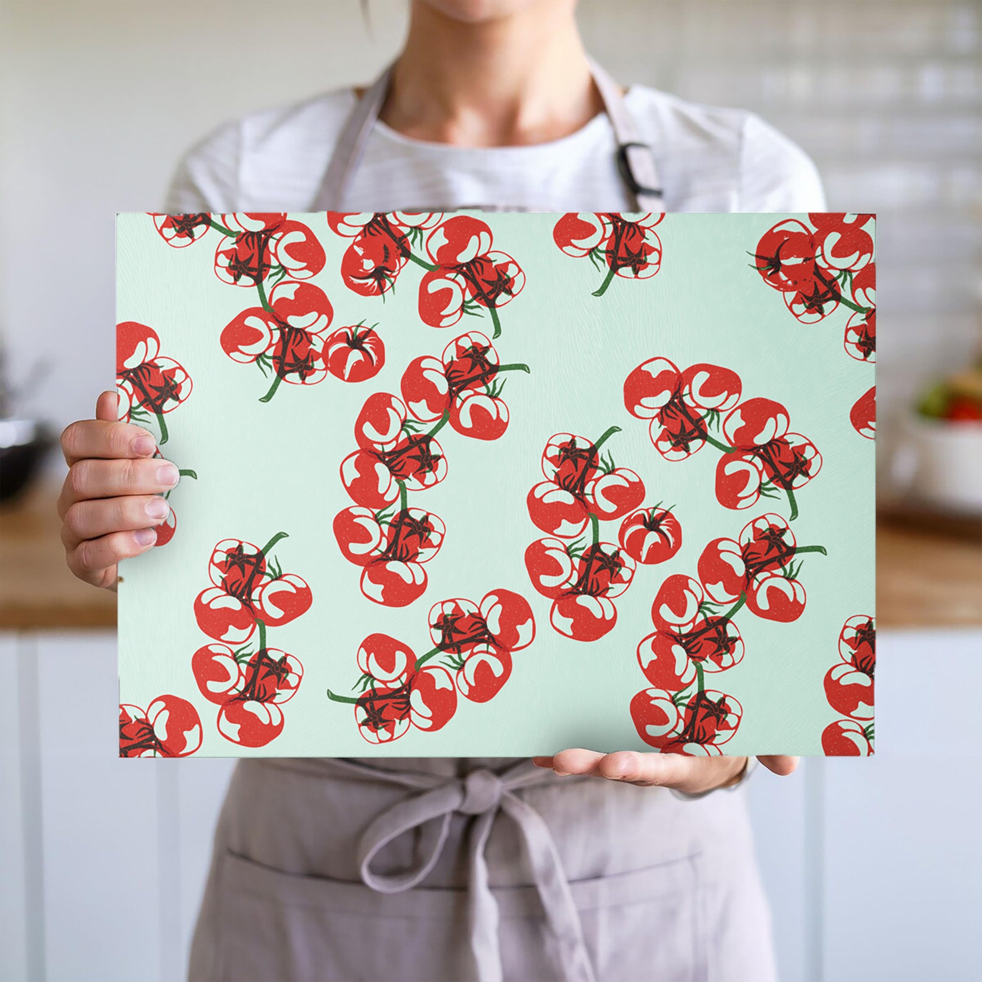 Close-up of tomato block print design on textured tempered glass cutting board