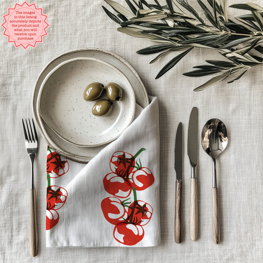 Tomato block print cotton twill cloth napkin displayed on elegant dining table setting with farmhouse kitchen decor