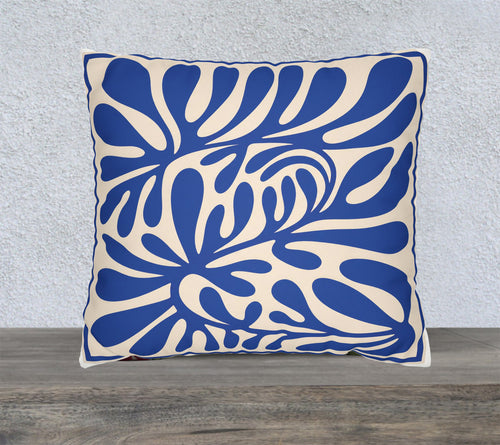 Blue Mediterranean abstract faux suede cushion featuring oversized botanical cut-paper inspired artwork on a square decorative throw pillow.