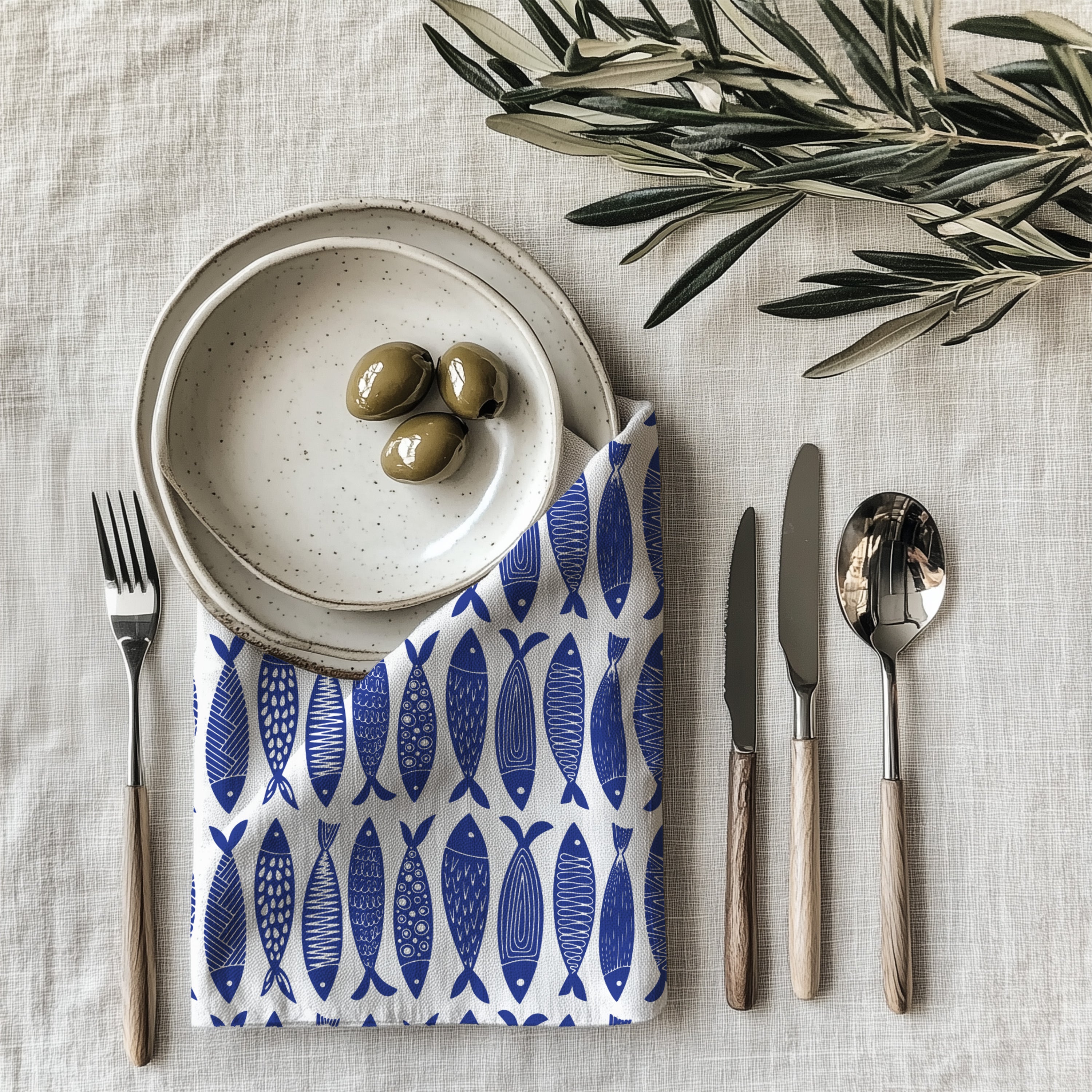 Nautical blue fish cloth napkin made from 100% cotton twill with neatly hemmed edges for stylish table settings