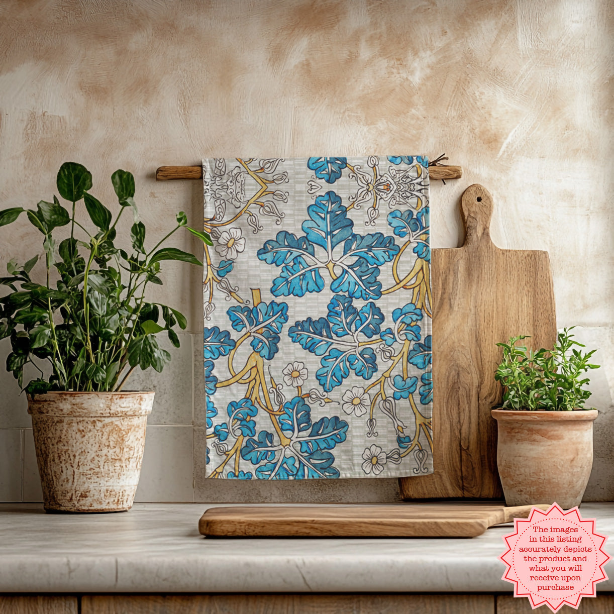 Blue Art Nouveau leaf tea towel hanging in a light modern kitchen