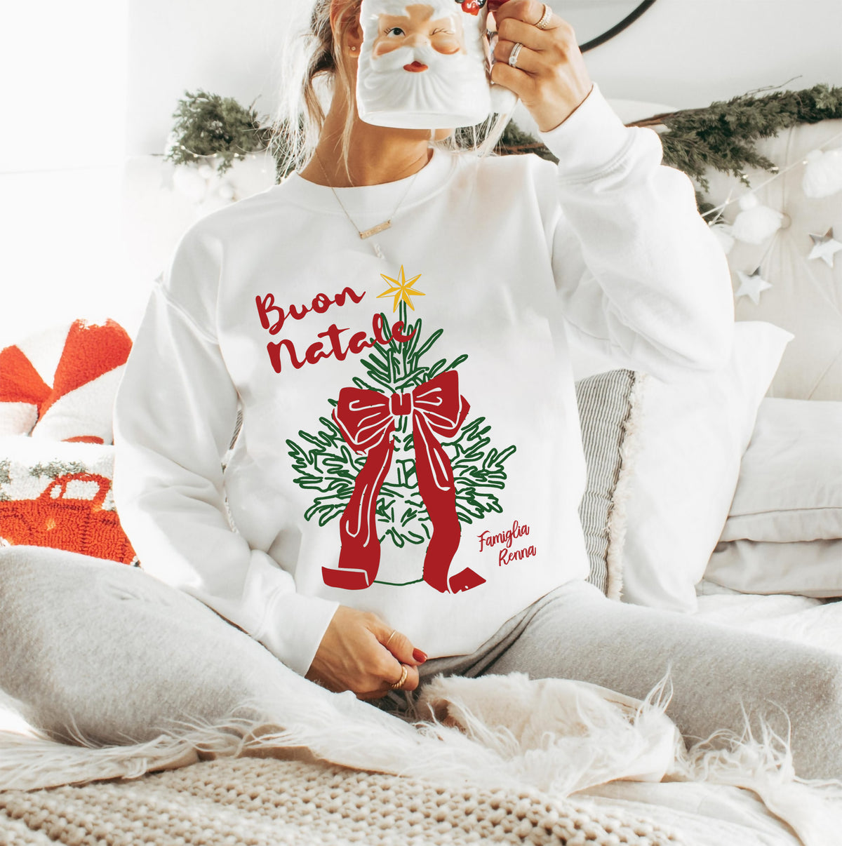 Buon Natale Italian Christmas sweatshirt featuring a Christmas tree, red bow and golden star on a white Gildan 18000 crewneck.