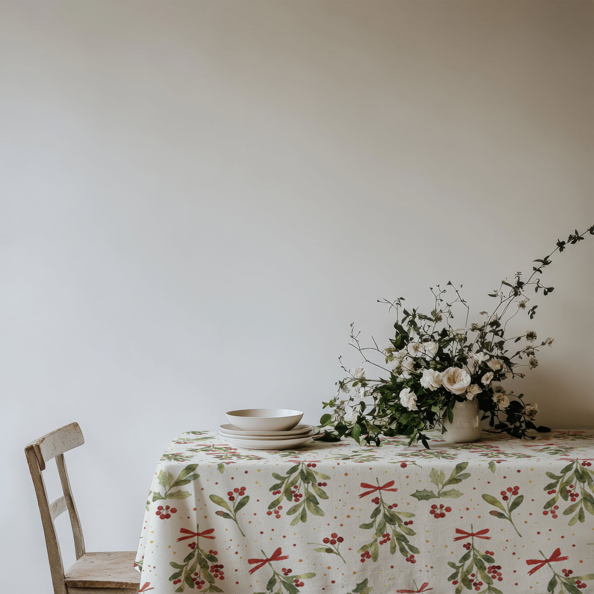 Watercolour Christmas mistletoe tablecloth featuring delicate botanical foliage for an elegant festive table setting.