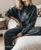 Dark Heather Christmas sweatshirt with Mediterranean-inspired folk-art Christmas tree design, featuring blue and green leaves with red and orange decorative flowers.