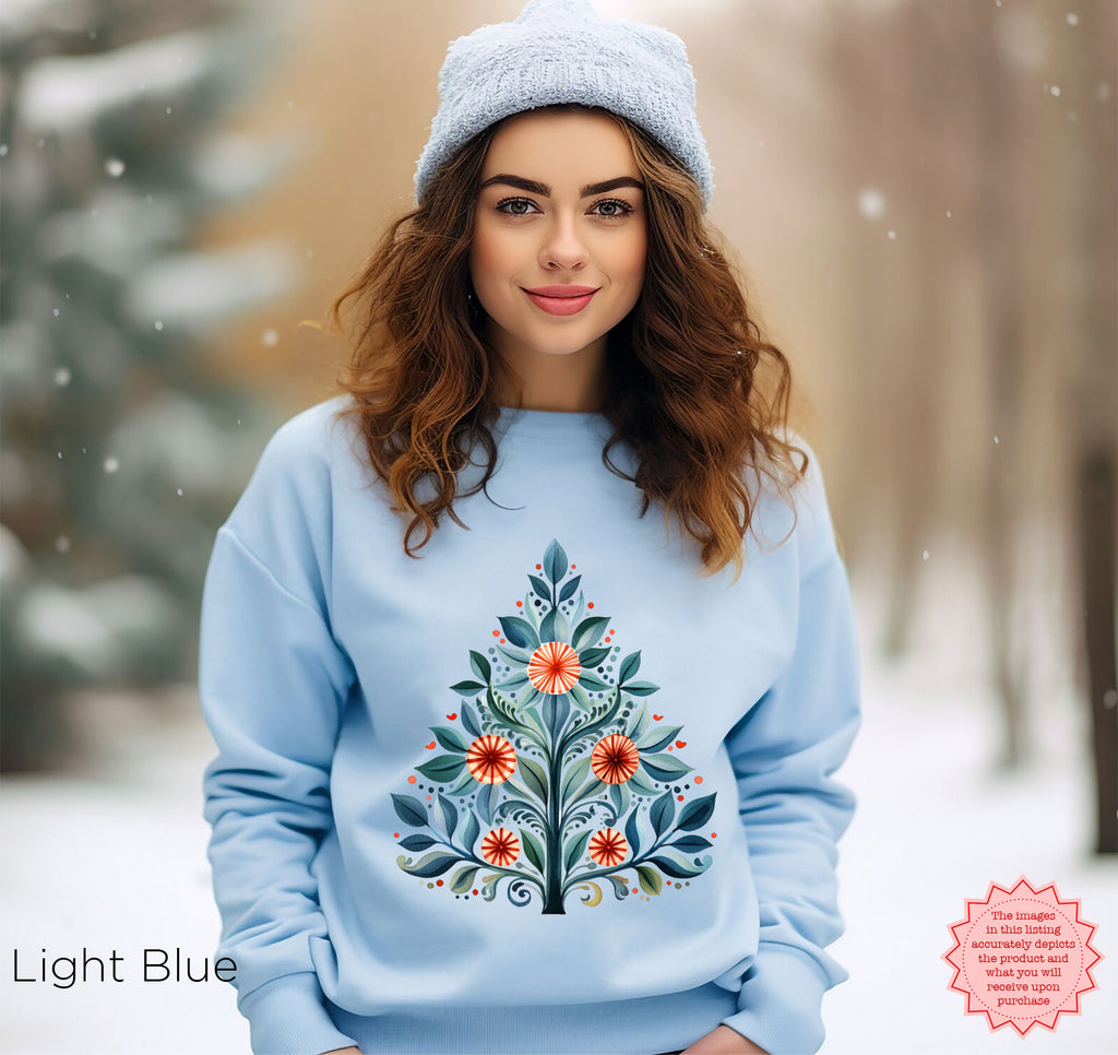 Light Blue Christmas crewneck featuring a Mediterranean-inspired folk-art Christmas tree design.