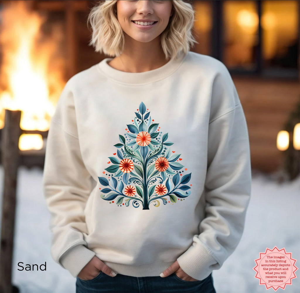 Mediterranean Christmas Tree sweatshirt featuring a colourful folk art Christmas tree design on a cosy crewneck, styled for a festive holiday look.