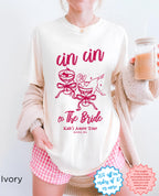 Red Cin Cin the Bride shirt front view – unisex Comfort Colors tee with pink “Cin Cin the Bride” DTG print, styled with black shorts.