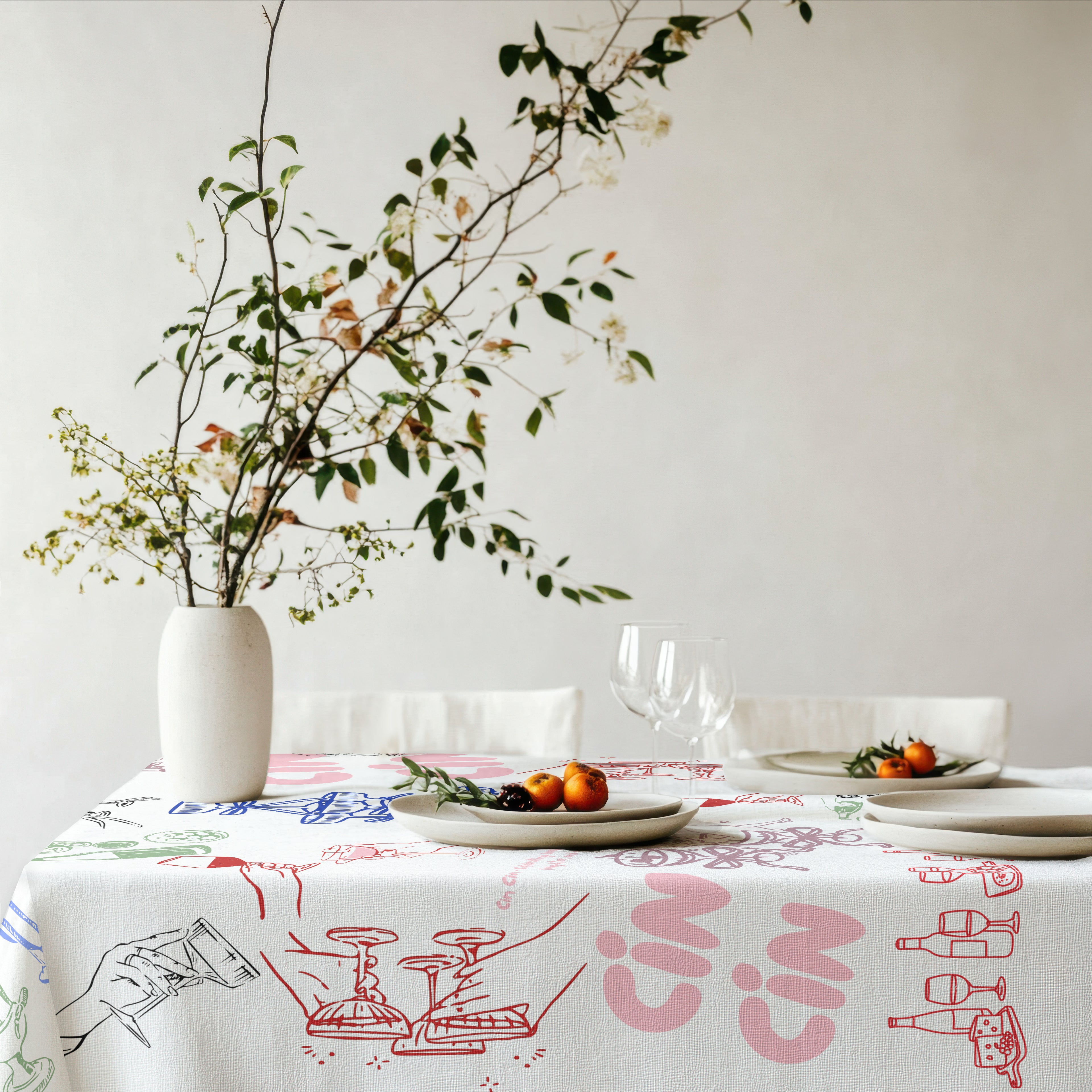 Mediterranean dining table styled with Cin Cin Celebration Tablecloth featuring colourful Italian summer illustrations