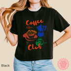 Coffee Club vintage t-shirt featuring a coffee cup, moka pot, and croissant in a vibrant illustration on a black crop top