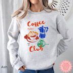 Coffee Club sweatshirt in ash color, featuring a retro coffee graphic with a croissant, coffee cup, and espresso machine design. Perfect for coffee lovers.