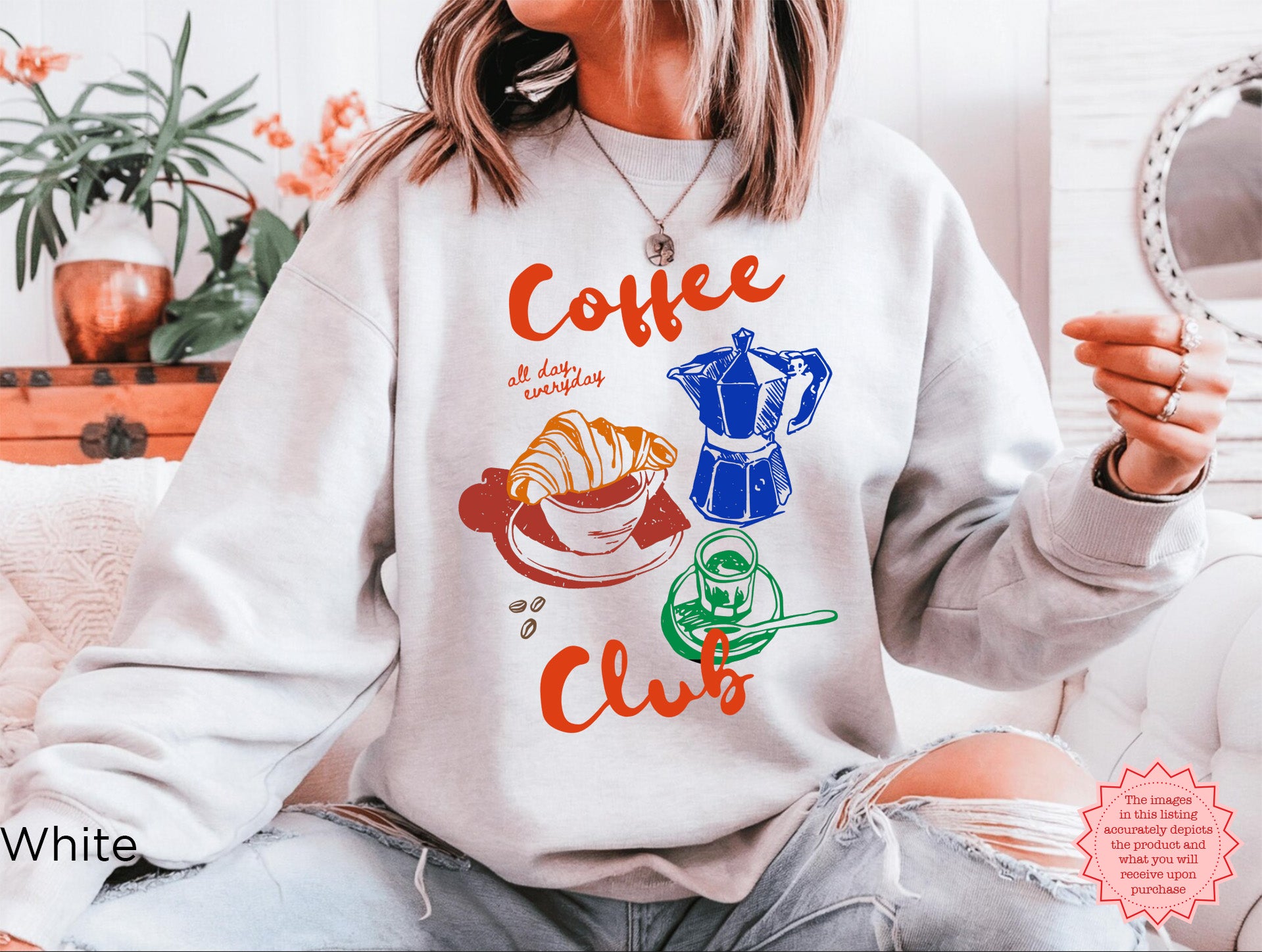 White Coffee Club sweatshirt with a colorful coffee-themed graphic design, featuring a croissant, espresso machine, and coffee cup. Perfect for casual coffee lovers.