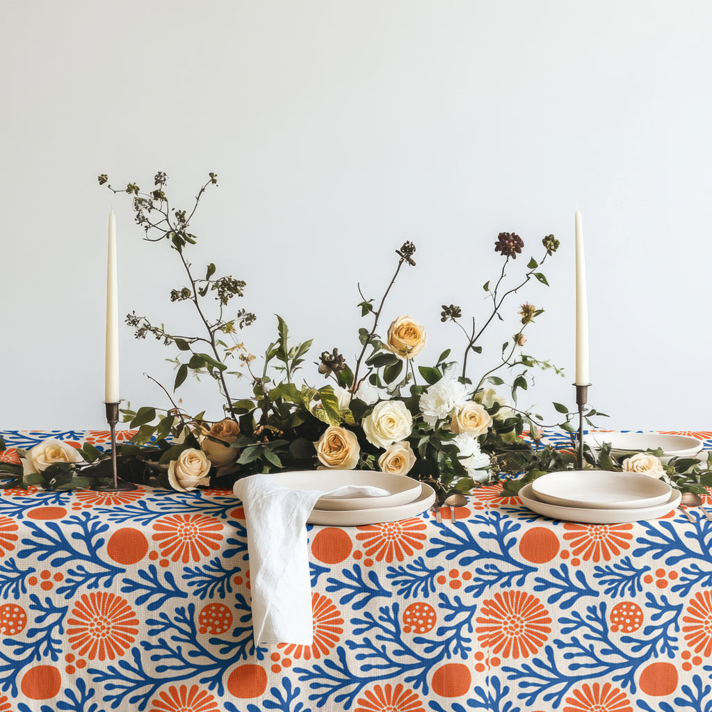 Coastal-inspired cotton twill tablecloth with a blue coral reef and terracotta botanical pattern.