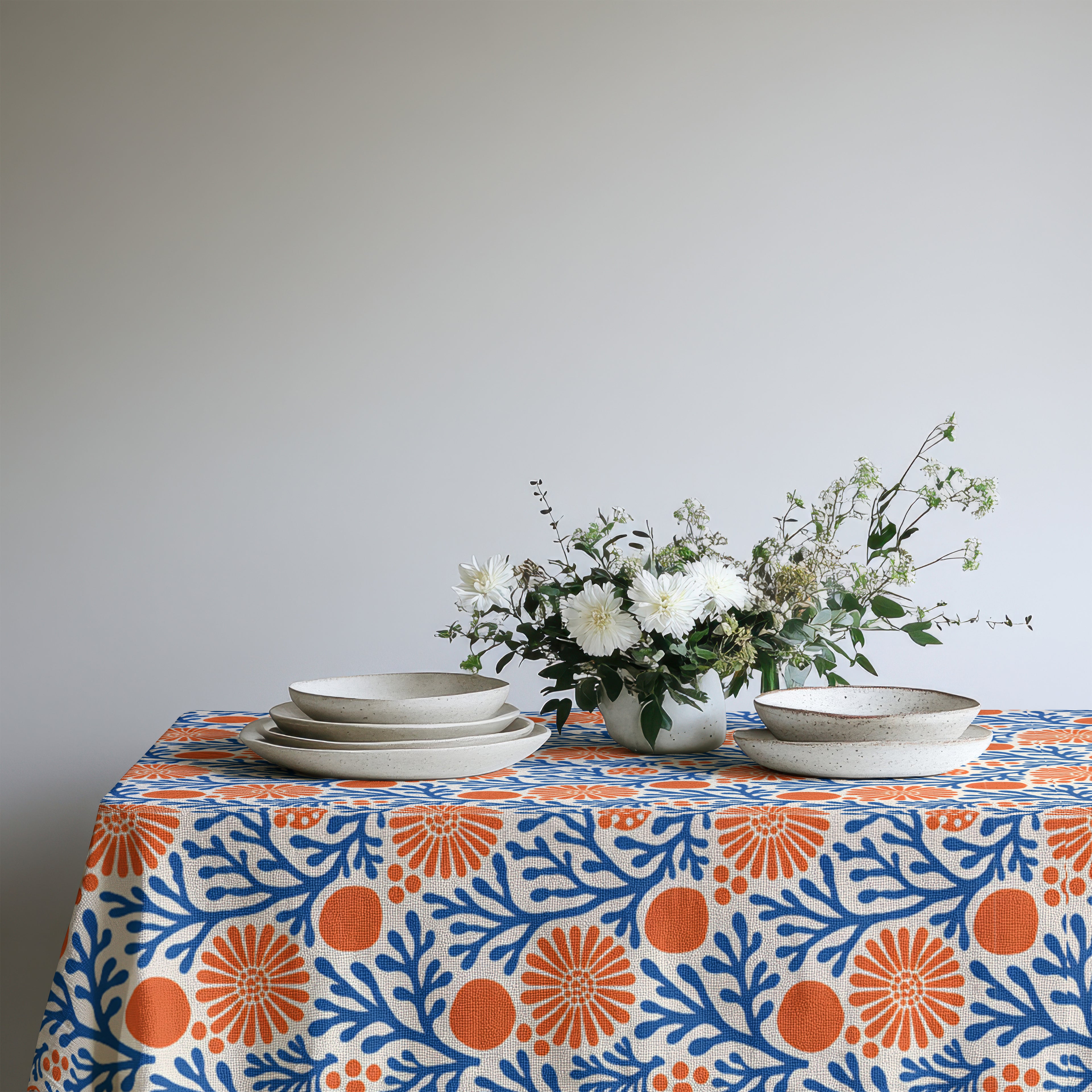 100% cotton twill Mediterranean tablecloth featuring a blue coral reef and terracotta floral print.