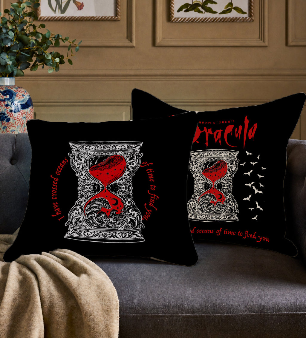 Gothic Halloween pillow cover featuring a bold red hourglass framed by decorative ivory patterns.