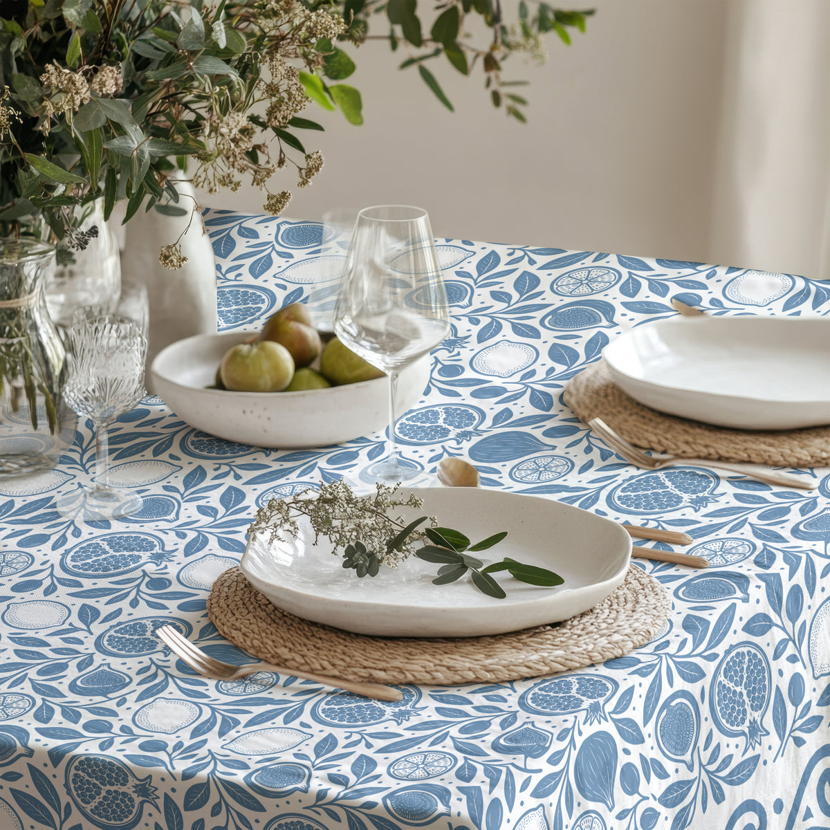 Pomegranate, fig and lemon tablecloth with dusty blue botanical pattern on white