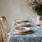 Dusty blue and white Mediterranean botanical tablecloth with pomegranate and fig motifs