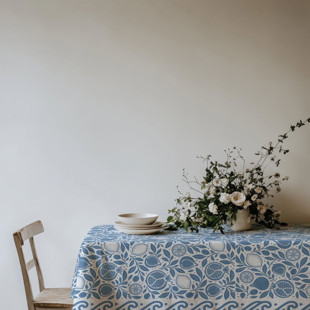 Close-up of dusty blue pomegranate and fig pattern on cotton twill tablecloth