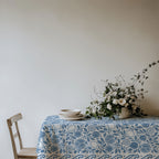 Close-up of dusty blue pomegranate and fig pattern on cotton twill tablecloth