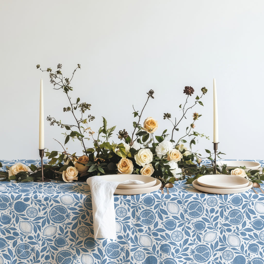Dusty blue pomegranate tablecloth with detailed fruit and botanical leaf design