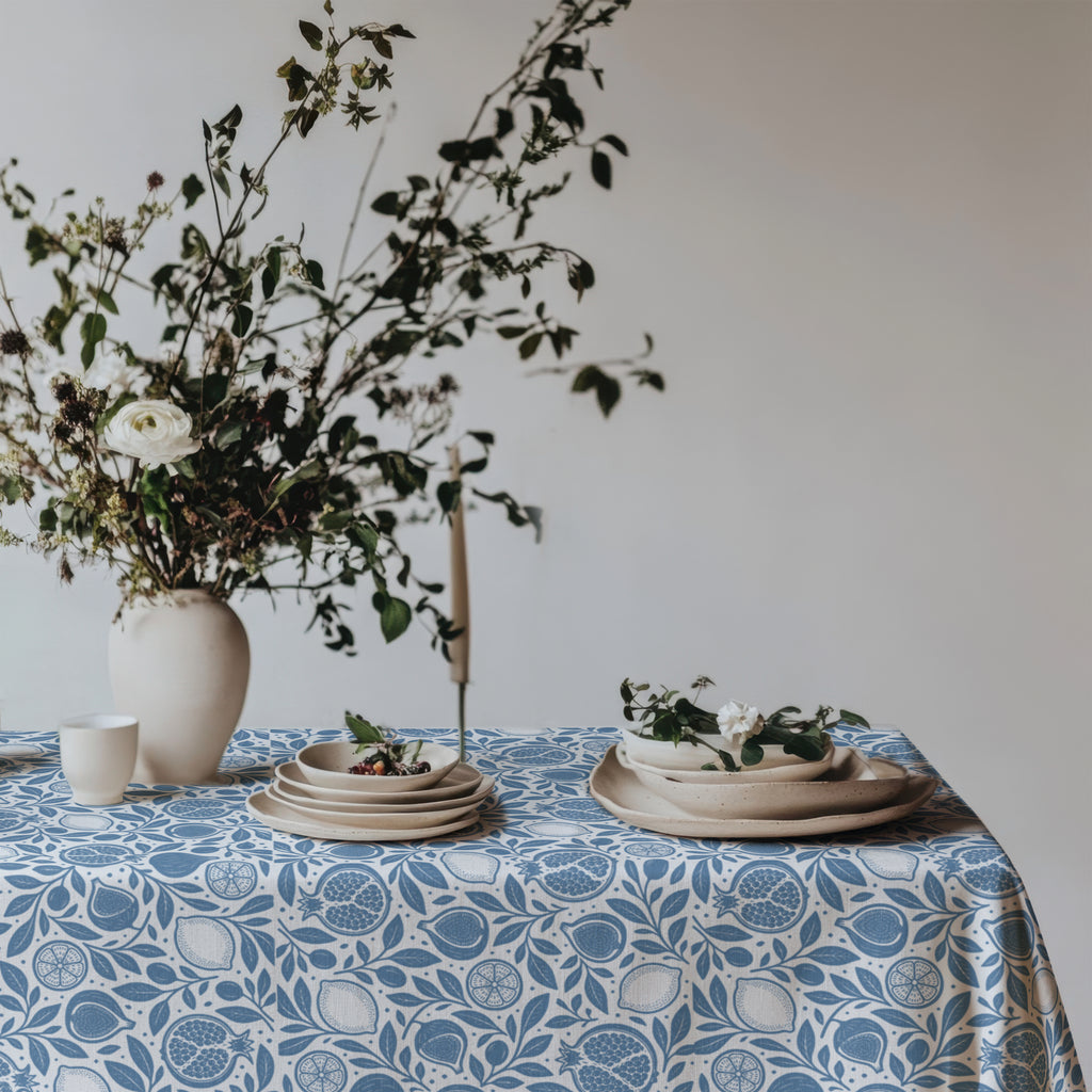 100% cotton twill tablecloth with dusty blue pomegranate, fig and lemon print