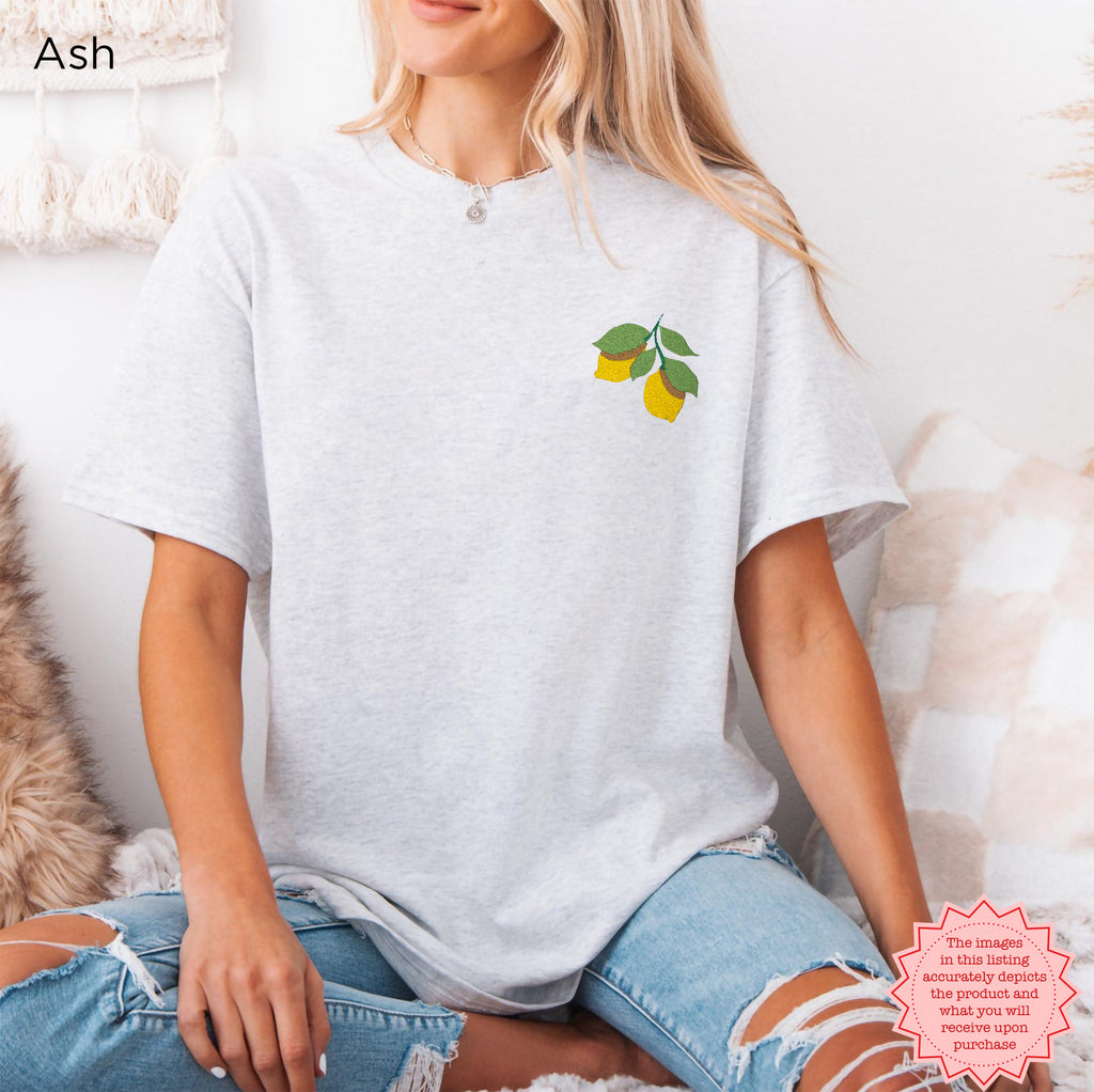 Front view of lemon embroidered Gildan 5000 t-shirt with minimalist citrus design
