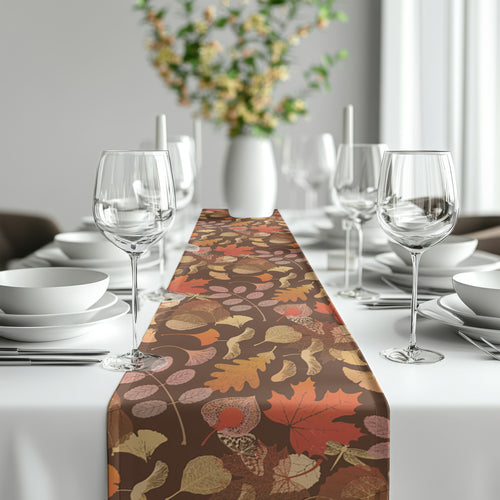 Autumn botanical leaf table runner featuring warm rust, brown, gold, and green tones