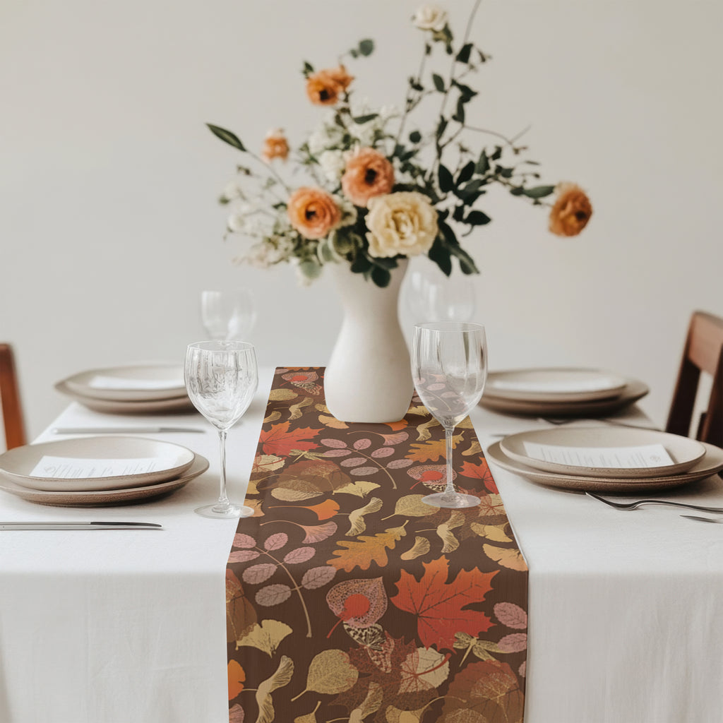 Close-up of autumn leaves pattern on a fall botanical table runner