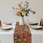 Close-up of autumn leaves pattern on a fall botanical table runner