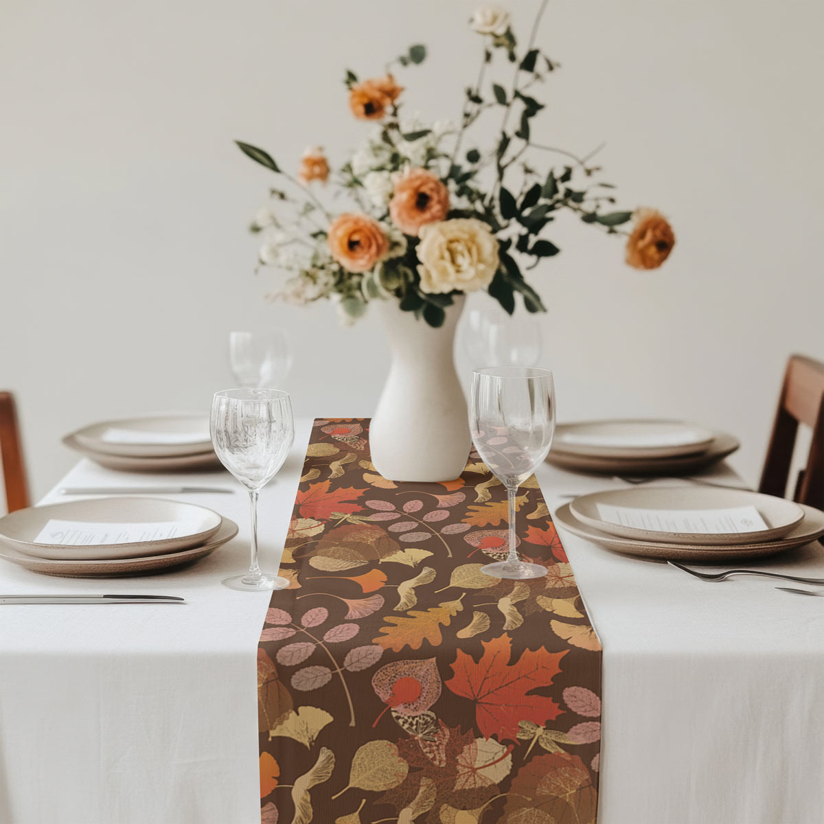 Close-up of autumn leaves pattern on a fall botanical table runner