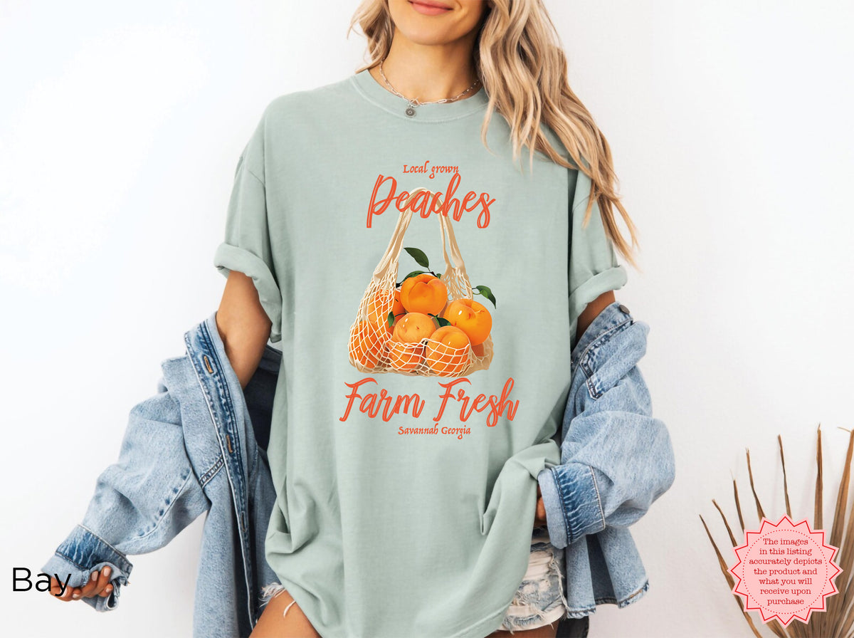 Close-up of the vintage lettering on the Farm Fresh Peaches T-shirt, including “Local Grown,” “Farm Fresh,” and “Savannah Georgia.”