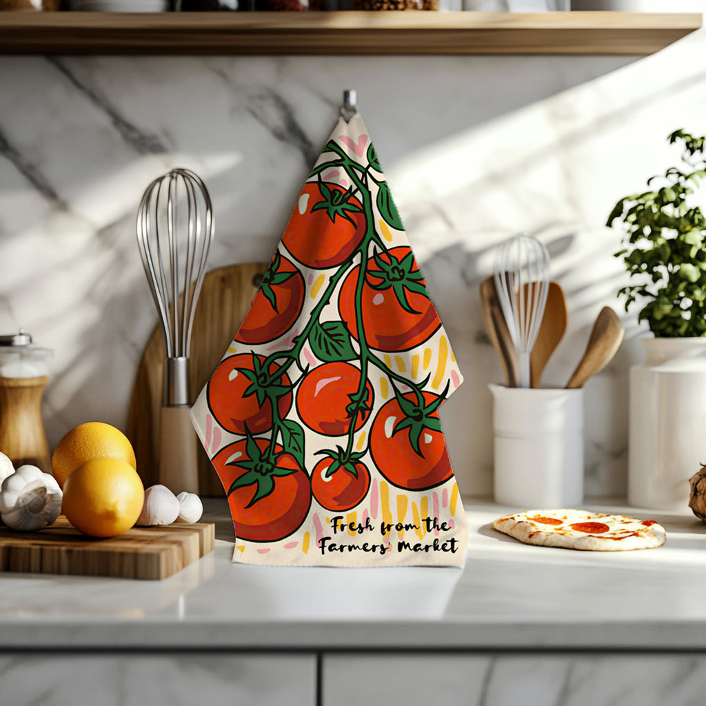 Functional kitchen towel featuring hand-drawn red tomatoes and leafy vines on durable cotton twill.