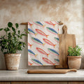 Fisherman's Market microfiber tea towel featuring a colourful Mediterranean fish pattern on a soft cream background.