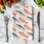 Close-up view of the Fisherman's Market tea towel showing detailed fish illustrations and premium printed fabric texture.