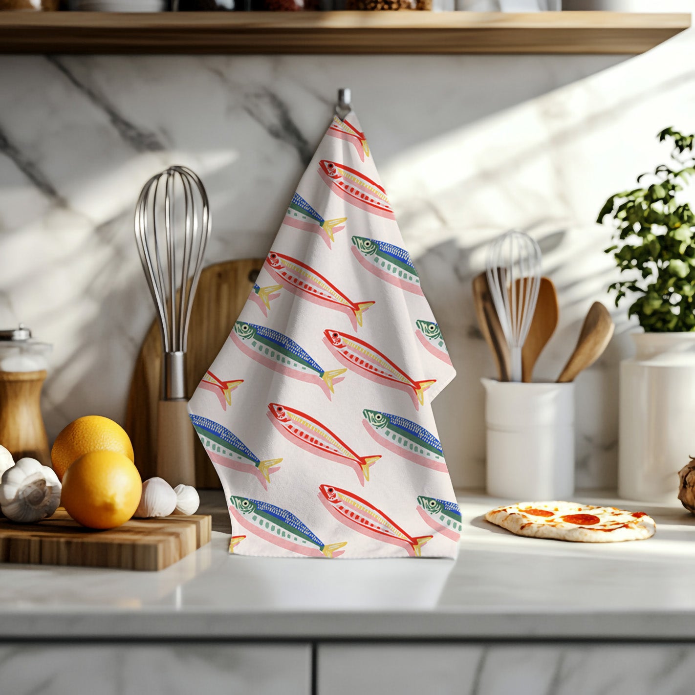 Fisherman's Market kitchen towel hanging in a modern coastal kitchen with Mediterranean-inspired décor.