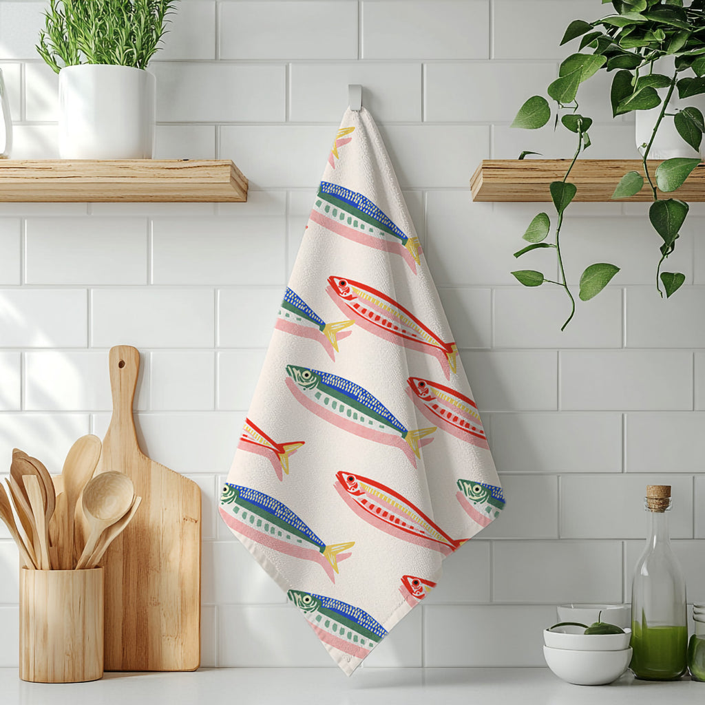 Decorative fish tea towel with colourful illustrated sea life pattern, combining style with quick-drying kitchen functionality.